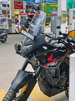 Black powder-coated carbon steel tank guard for Honda Transalp XL 750 
2023-2025 — installed view showing fitment on tank. left view
